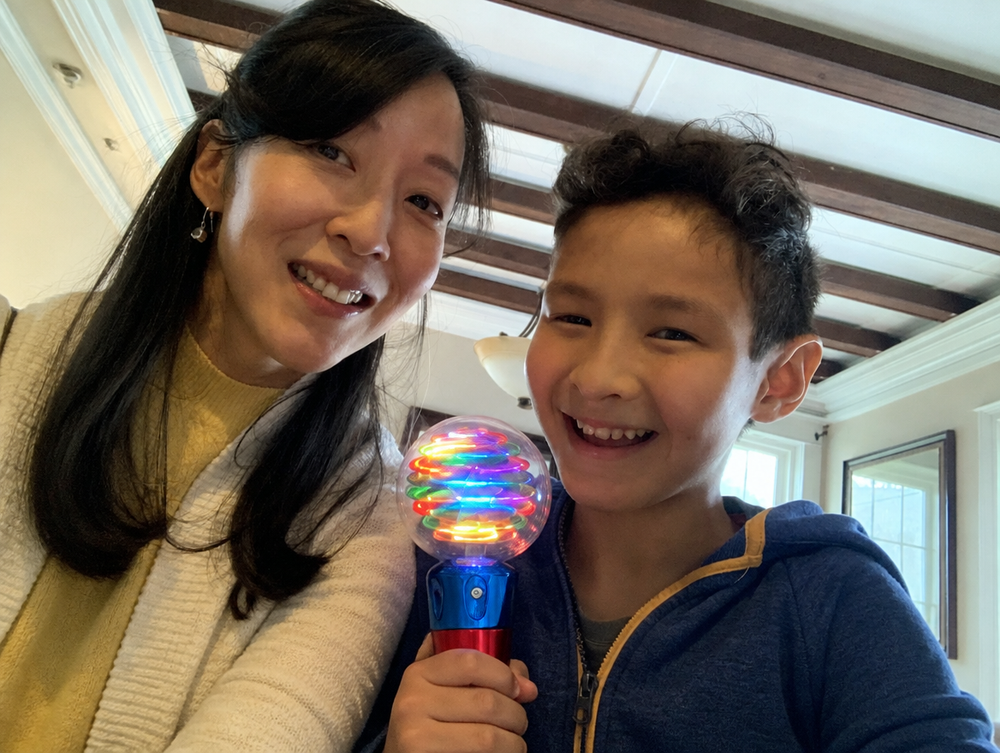 Family photo edited to show the Mimsy Glow & Spin Sensory Wand